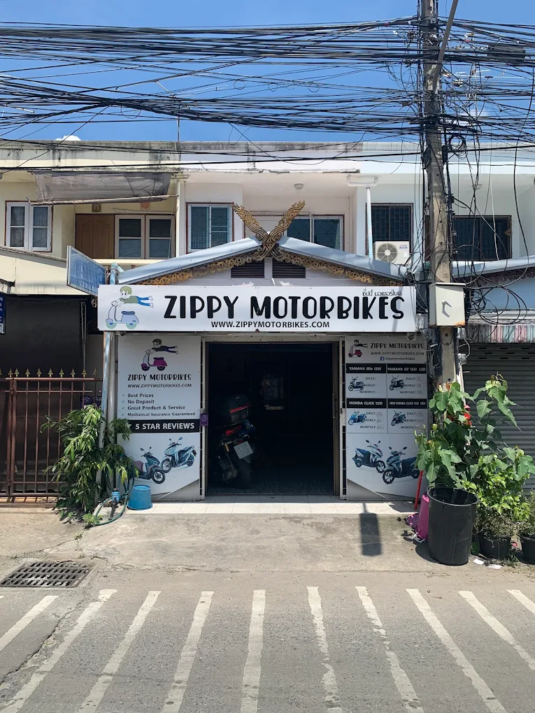 Zippy Motorbike Rentals shop front and bikes lined up outside in Chiang Mai